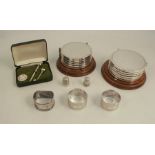 A group of hallmarked silver, to include two sets of six silver mounted coasters, three napkin