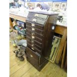 A painted pine filing cabinet, fitted with ten drawers, width 14ins, height 39ins