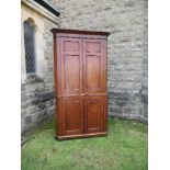 A Georgian oak freestanding double corner cupboard