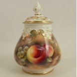 A Royal Worcester covered vase, painted half round with hand panted fruit by Love, shape number