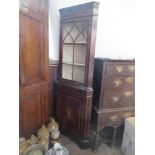 A reproduction corner cupboard