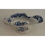 A first period Worcester, silver shaped sauce boat decorated in blue and white with the Fisherman