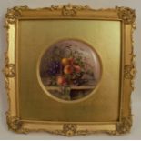 A Royal Worcester circular porcelain plaque, decorated with a still life study of flowers  and fruit