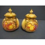 A pair of Royal Worcester covered quarter lobed pot pourri vases, decorated half round with hand