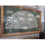 A large cased ivory and lace fan, with foliate decoration and having 18 spines, width 26ins