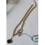 A 9 carat gold watch chain, of uniform solid cub links, with a T bar, swivel and bolt ring, 48.5cm