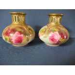 A pair of Royal Worcester quarter lobed vases, having pierced necks and decorated with roses,