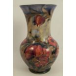 A Moorcroft vase, decorated with flowers, height 6.25insCondition Report: Crazed but otherwise ok