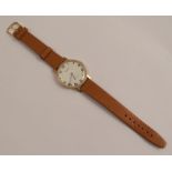 Tissot, a gentleman's wristwatch on a strap, the 9 carat gold case with a presentation inscription