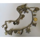 A silver double watch chain, of solid uniform curb inks, with various charms attached, 109g gross
