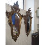 A pair of Italian style mirrors, of tapering shield form, with scroll and shell moulding, mirror