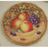 A Royal Worcester plate, decorated with hand painted fruit by Love, to a gadrooned border,