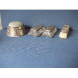 A hallmarked silver pin cushion, together with two silver top glass dressing table boxes, and a