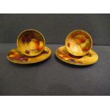 Two Royal Worcester miniature tea cups and saucers, decorated with hand painted fruit, by Ayrton,