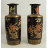 A pair of Keeling & Co, Losol ware vases , decorated with flowers and buildings in the oriental