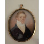 J Steele, a 19th century oval watercolour miniature painted on ivory, portrait of a gentleman,