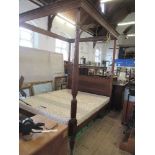 A 19th century Hepplewhite style four poster bed, with turned, fluted and carved front posts, length
