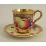 A Royal Worcester coffee cup and saucer, decorated with hand painted fruit by P PlattCondition