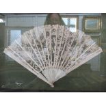 A cased ivory and lace fan, having 18 spines, width 14ins