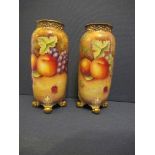 A pair of Royal Worcester cylindrical shaped spilll vases, decorated all around in hand painted