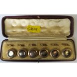 A cased set of mother of pearl dress buttons