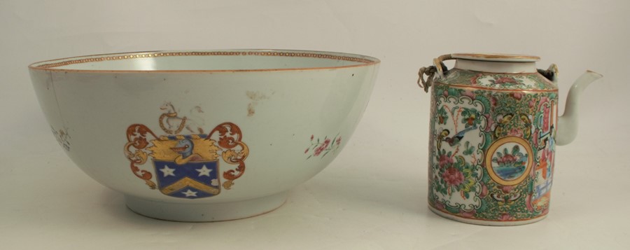 A Chinese export punch bowl, decorated with an armorial and flowers, hairline cracks, diameter