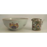 A Chinese export punch bowl, decorated with an armorial and flowers, hairline cracks, diameter
