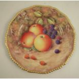 A Royal Worcester plate, decorated with hand painted fruit by Love, to a gadrooned border, af,