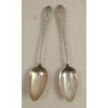 A pair of early 19th century Irish silver dessert spoons, with engraved decoration and initials,