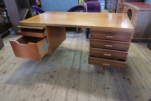 A large Gordon Russel teak twin pedestal desk, having a bank of drawers to one side and a fold - Image 2 of 4