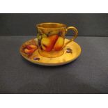 A Royal Worcester coffee cup and saucer, decorated with hand painted fruit by HaleCondition