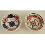 A pair of 19th century spongeware pottery patty pans, with polychrome floral decoration, diameter