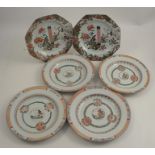 A pair of Oriental octagonal plates, decorated in the famille rose palette, diameter 8.75ins,