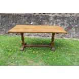An 'Eagleman' oak refectory table,with adze finish,  stamped to the leg, length 66.25ins x width