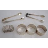 Three hallmarked silver napkin rings, weight 2oz, together with a hallmarked silver pill box, with