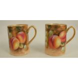 Two Royal Worcester tankards, decorated with hand painted fruit to a mossy background, one signed