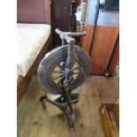 An Antique style oak spinning wheel