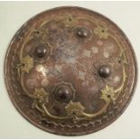 An Ottoman or Indian hand shield, of dome form, with brass inlay, diameter 9.5ins