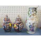 A small pair of covered imari vases, heights 7ins, together with a 19th century vase, decorated with