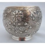 A Scottish silver bowl, of bulbous form, embossed with flower heads, Edinburgh 1900, weight 3oz,