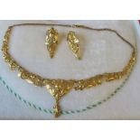 An Eastern necklace and earrings set, the necklace and earrings tested as 22 carat gold minimum,