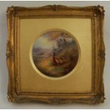 A Royal Worcester circular porcelain plaque, decorated with a cock and hen pheasant in landscape