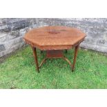 An Edwardian mahogany  octagonal shaped centre table, with cross banded decoration, raised on four