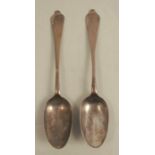 A pair of mid 18th century trifid end serving spoons, with rat tail to the bowl, bottom marked,