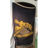 An Irish flag, with a figurehead on blue background, 64ins x 36ins approx