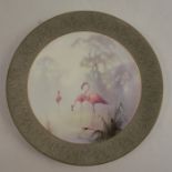 A Royal Worcester plate, decorated with a large central panel of flamingos by William Powell, to