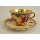A Royal Worcester tea cup and saucer, decorated with hand painted fruit by P PlattCondition