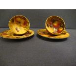 Two Royal Worcester miniature tea cups and saucers, decorated with hand painted fruit by Roberts and