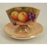 A Royal Worcester porcelain cigarette holder, raised on a small dish, decorated with hand painted