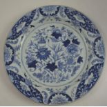 A Chinese wall plate, decorated in blue and white with foliage and bamboo, diameter 13.5insCondition